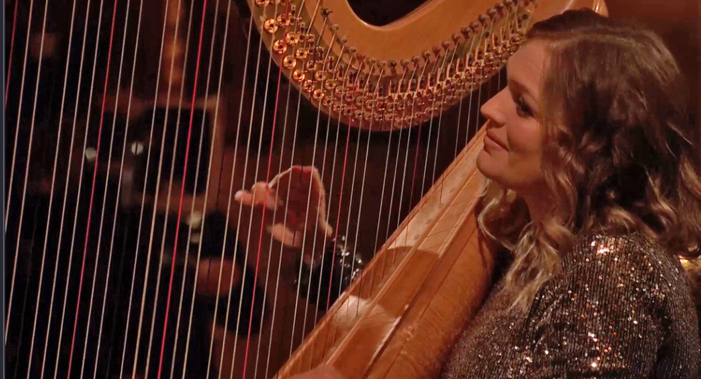 Harpist Hannah Stone playing at Brecon Cathedral for The Metropolitan Opera
